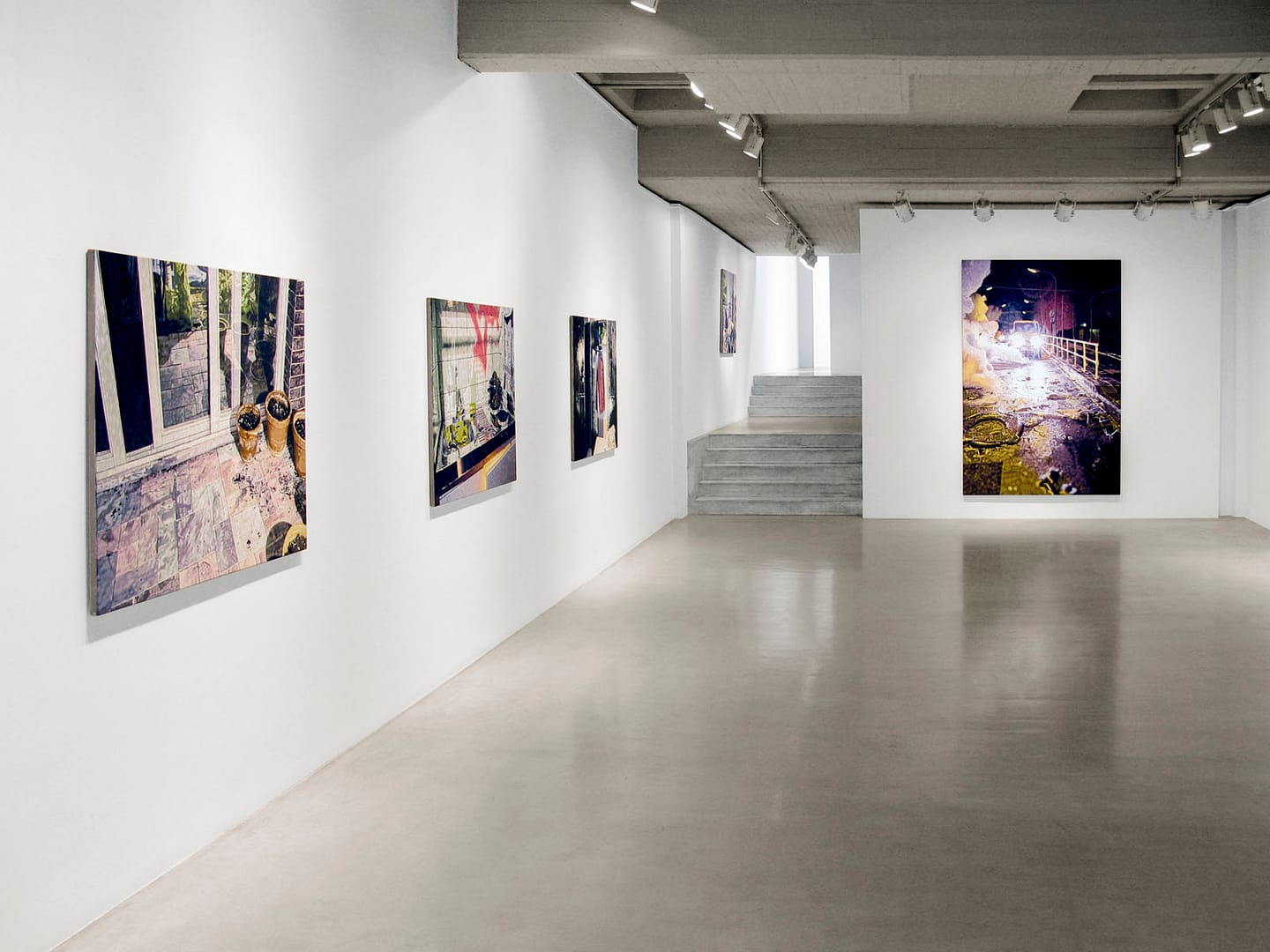 Exhibition view from the solo show "Scare the Night Away" by Philipp Fröhlich at Soledad Lorenzo gallery in Madrid, Spain, 2010. The photo shows the main space of the galley with various tempera paintings on canvas.