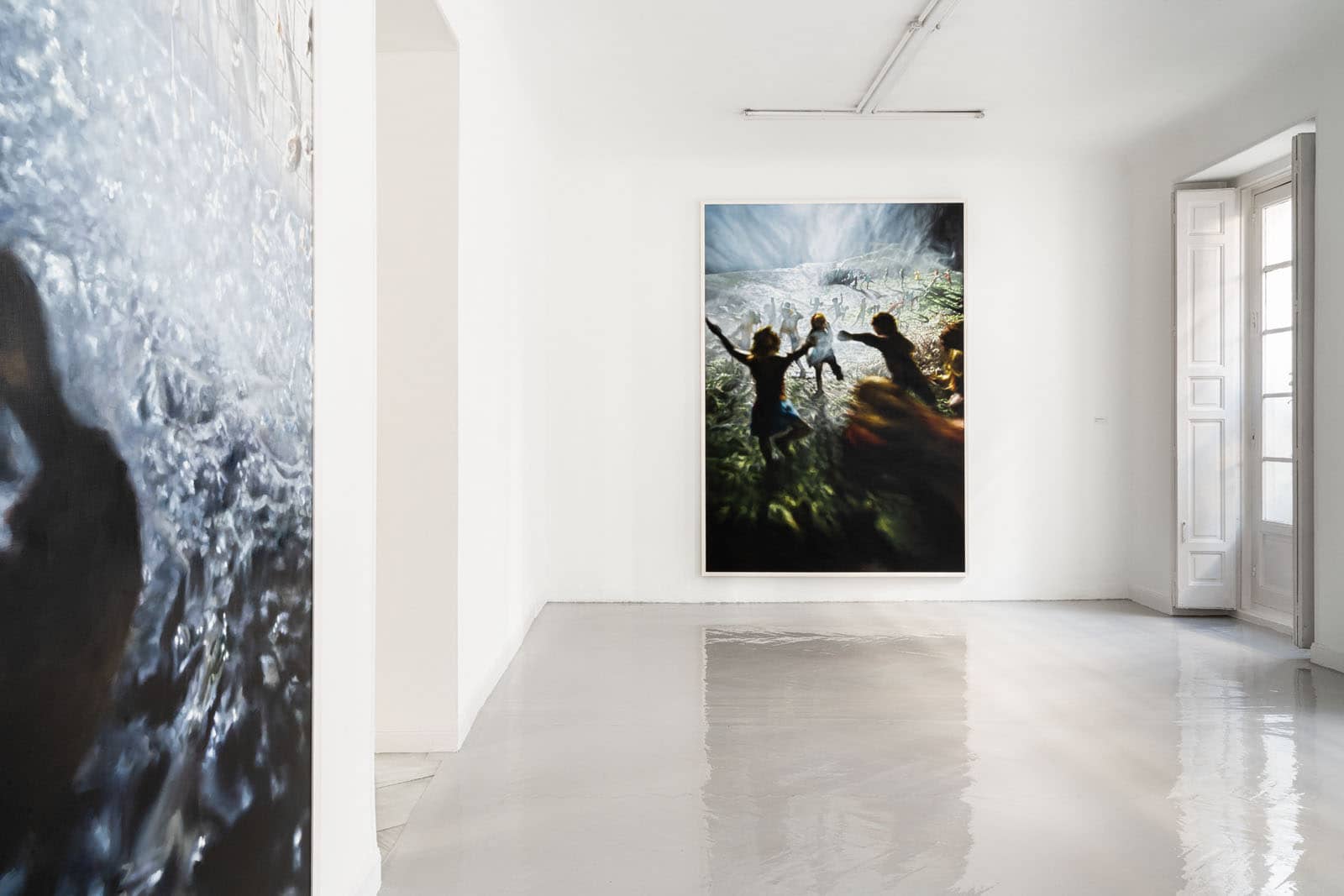 Exhibition view of the solo show "Falada" by Philipp Fröhlich at Juana de Aizpuru gallery in Spain, 2022. The image shows a fragment and another painting based on the legend of the pied piper, as collected by the brothers Grimm.